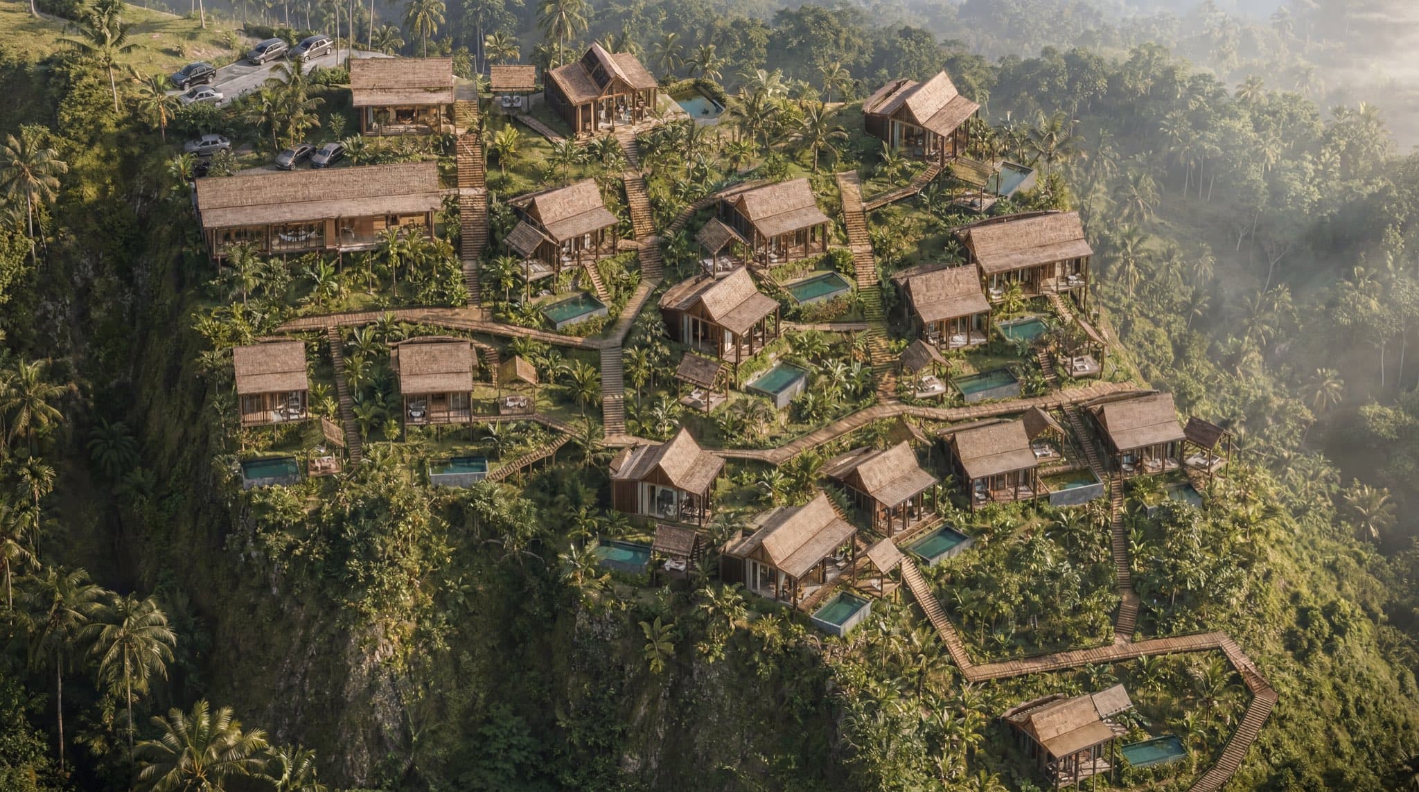 Aerial view of the full Maison Verde development — Ironwood villas, private pools and wooden walkways threaded along the Tegalalang hillside